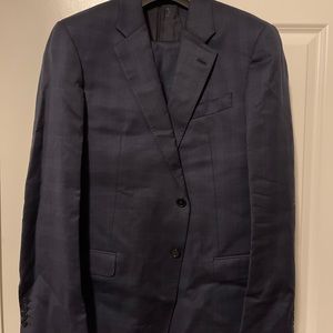 Suit is Navy w/ gray stripes